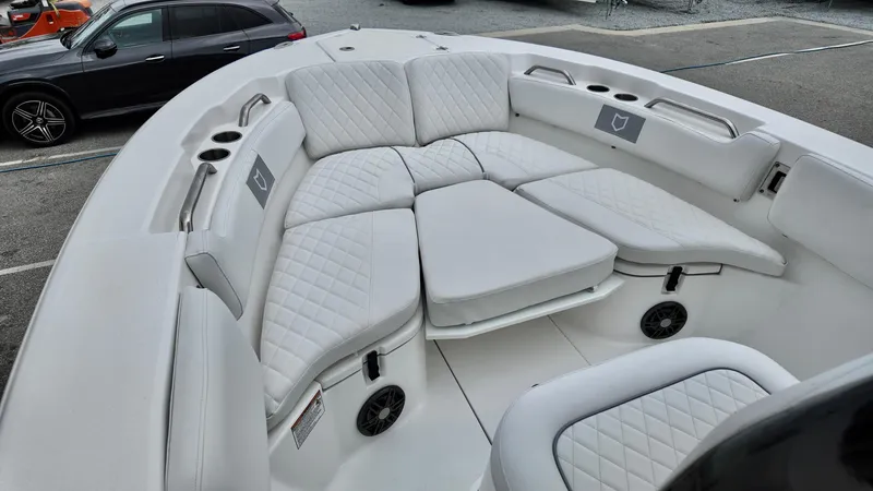 Slide: The Image of 2025 Sea Fox 228 Commander boat interior with white cushioned seating. - 10