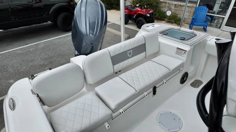Slide: The Image of 2025 Sea Fox 228 Commander boat interior with cushioned seating and modern design. - 15