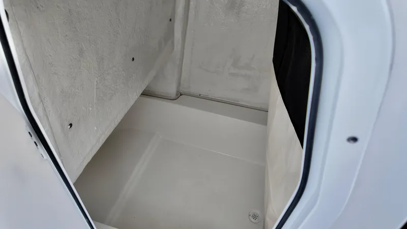 Slide: The Image of Interior cabin of 2025 Sea Fox 228 Commander boat, featuring spacious storage area. - 26