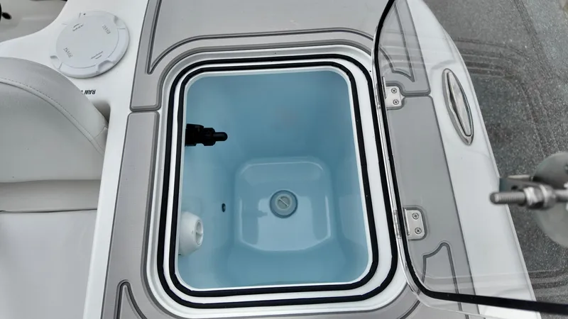 Slide: The Image of Livewell compartment on 2025 Sea Fox 228 Commander boat, open lid view. - 27