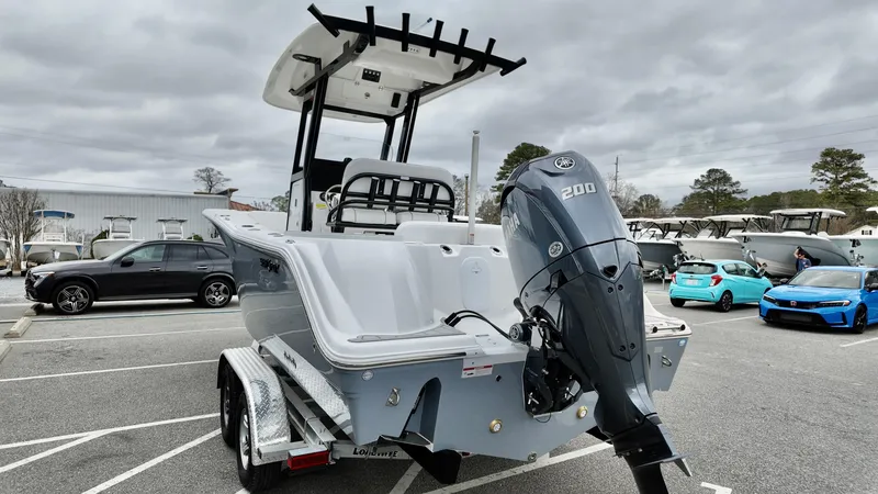 Slide: The Image of 2025 Sea Fox 228 Commander boat with Yamaha 200 engine in parking lot. - 6