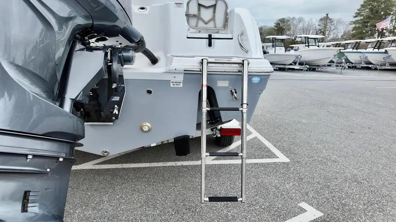 Slide: The Image of 2025 Sea Fox 228 Commander boat with ladder and motor in parking lot. - 8