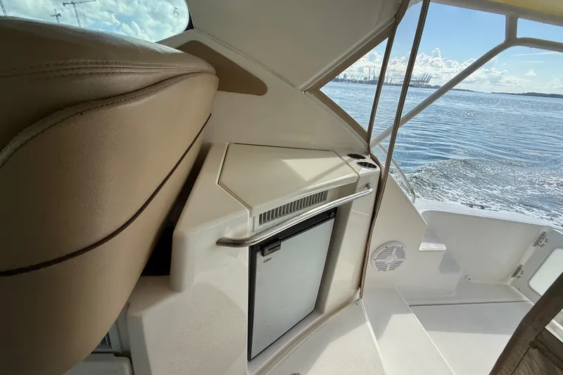 Slide: The Image of 2014 Tiara Yachts 4500 Sovran cruising, view from the deck with water wake. - 17