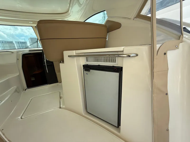 Slide: The Image of Interior of 2014 Tiara Yachts 4500 Sovran, featuring luxurious seating and helm. - 19