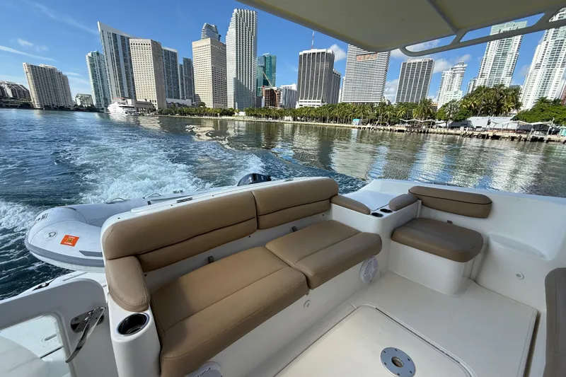 Slide: The Image of 2014 Tiara Yachts 4500 Sovran with spacious seating, cruising on open water. - 2