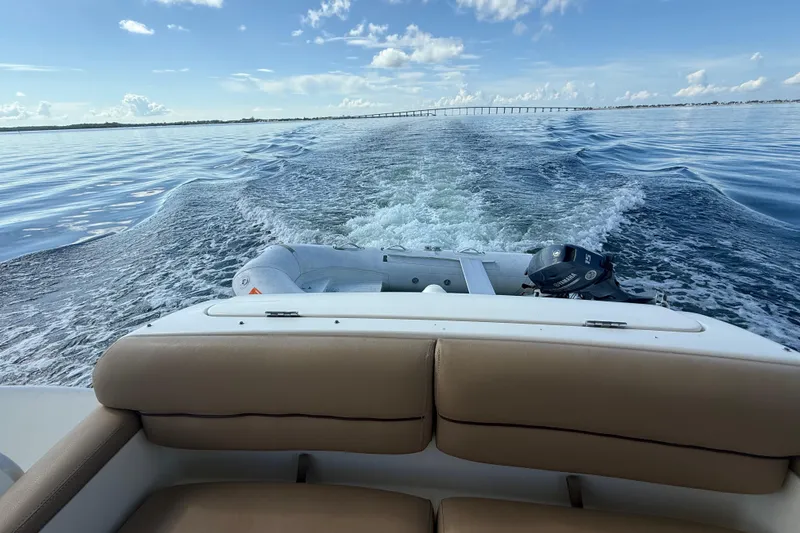 Slide: The Image of 2014 Tiara Yachts 4500 Sovran cruising with city skyline in the background. - 3