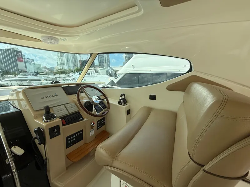 Slide: The Image of Control panel of 2014 Tiara Yachts 4500 Sovran with labeled switches. - 37