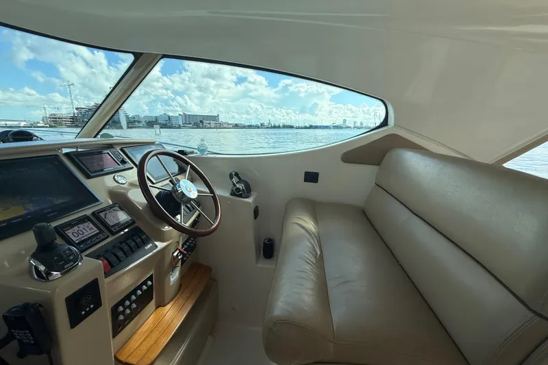 Slide: The Image of Interior of 2014 Tiara Yachts 4500 Sovran, featuring helm and leather seating. - 38