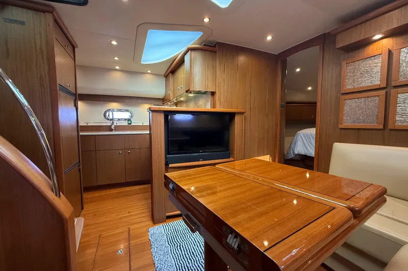 Slide: The Image of Luxurious interior of 2014 Tiara Yachts 4500 Sovran with elegant seating and wooden accents. - 43