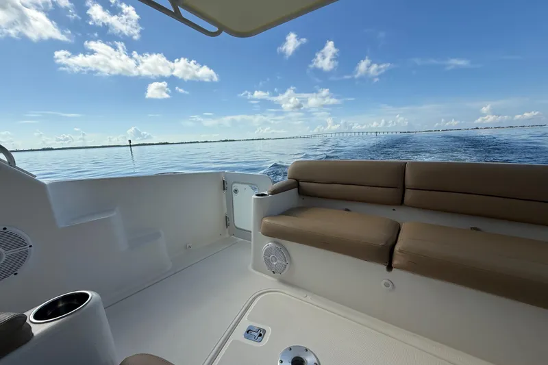 Slide: The Image of Tiara Yachts 4500 Sovran 2014 cruising near city skyline, leaving a wake. - 5