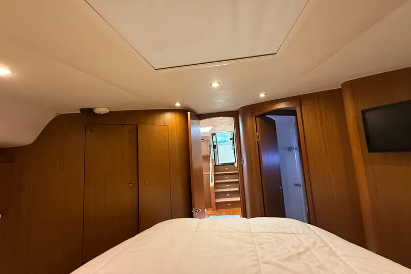 Slide: The Image of Luxurious cabin interior of 2014 Tiara Yachts 4500 Sovran with cozy bedding. - 59