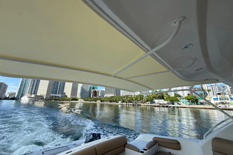 Slide: The Image of Storage compartments on a 2014 Tiara Yachts 4500 Sovran, filled with boating gear. - 7