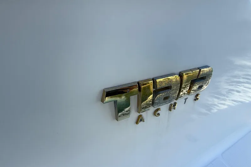 Slide: The Image of 2014 Tiara Yachts 4500 Sovran deck with cushioned seating and hatch. - 75