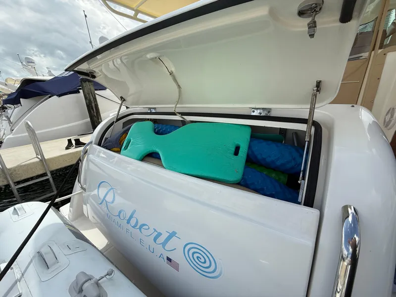 Slide: The Image of 2014 Tiara Yachts 4500 Sovran with open storage compartment at marina. - 82