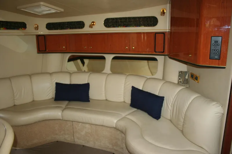 Slide: The Image of Electrical panel of a 1999 Sea Ray 400 Sundancer boat, featuring various switches and controls. - 15