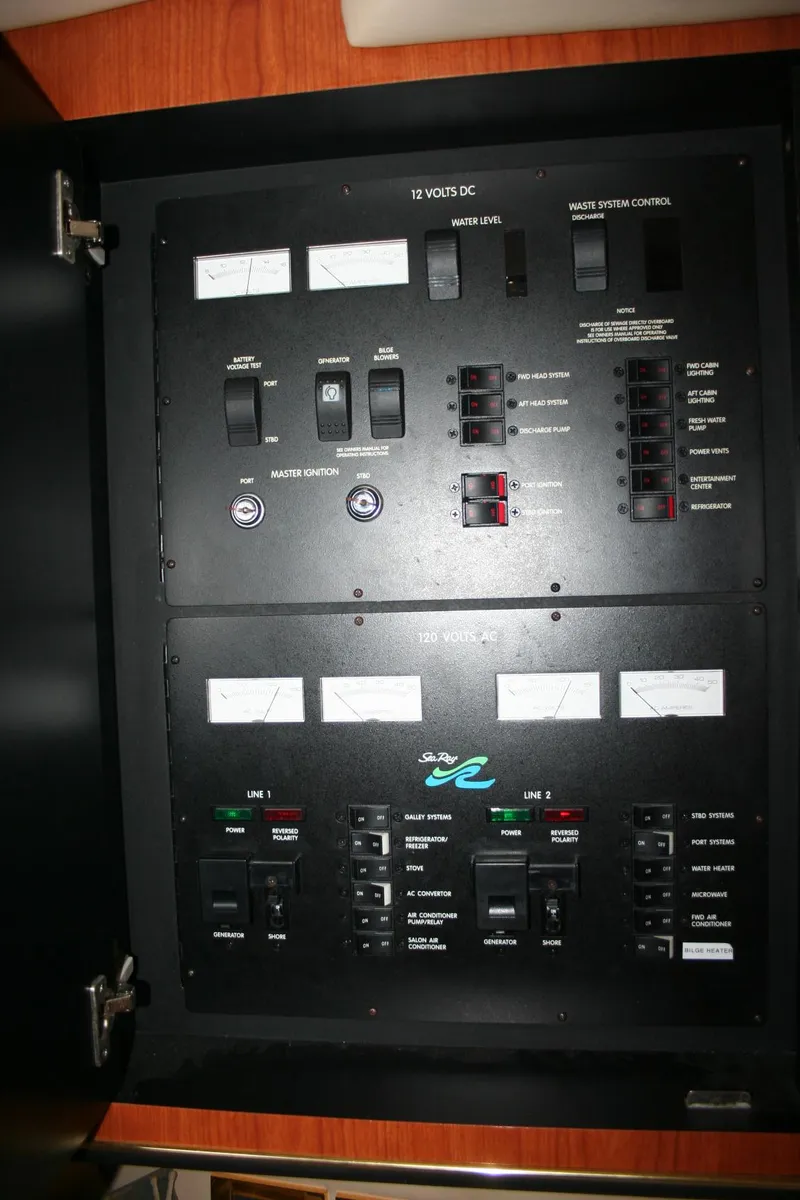 Slide: The Image of 1999 Sea Ray 400 Sundancer interior with TV, fridge, microwave, and sink. - 17