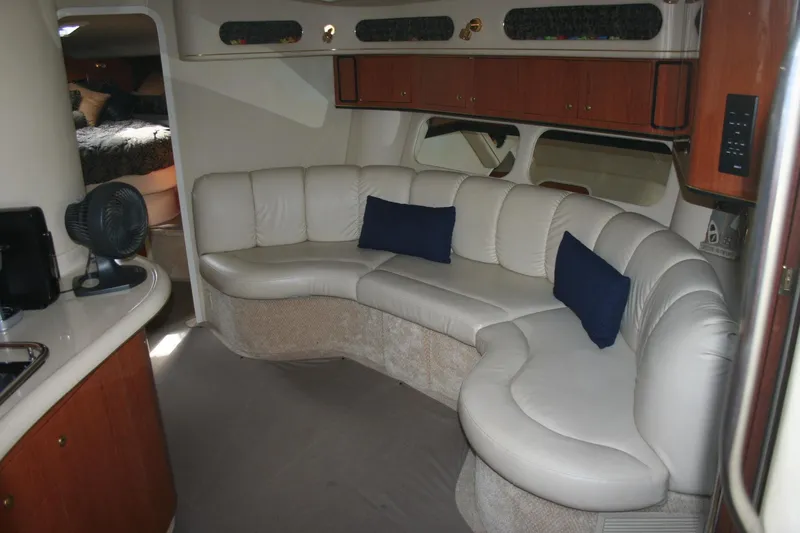 Slide: The Image of Engine compartment of a 1999 Sea Ray 400 Sundancer boat, showcasing mechanical components. - 23