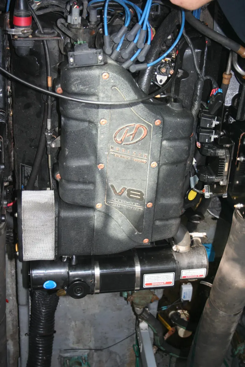 Slide: The Image of Batteries in a 1999 Sea Ray 400 Sundancer boat engine compartment. - 24