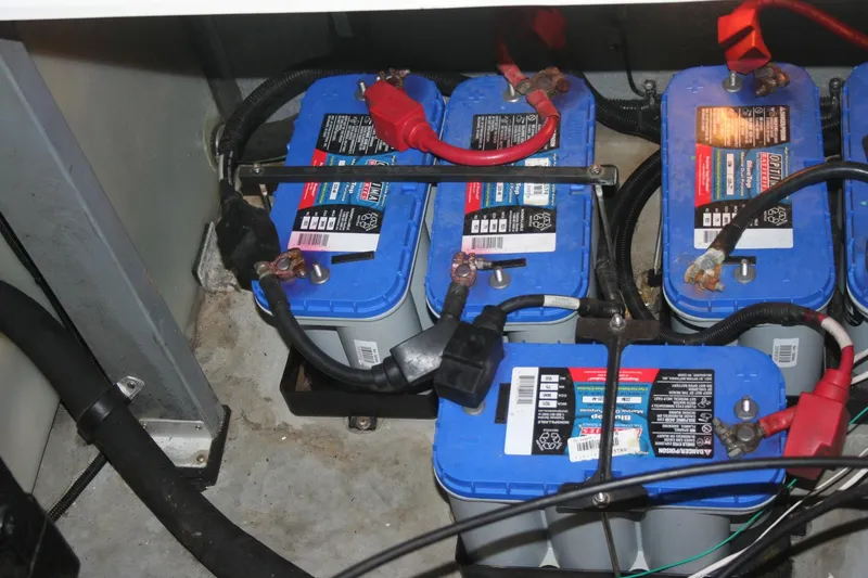 Slide: The Image of 1999 Sea Ray 400 Sundancer helm with wood steering wheel and control panel. - 26