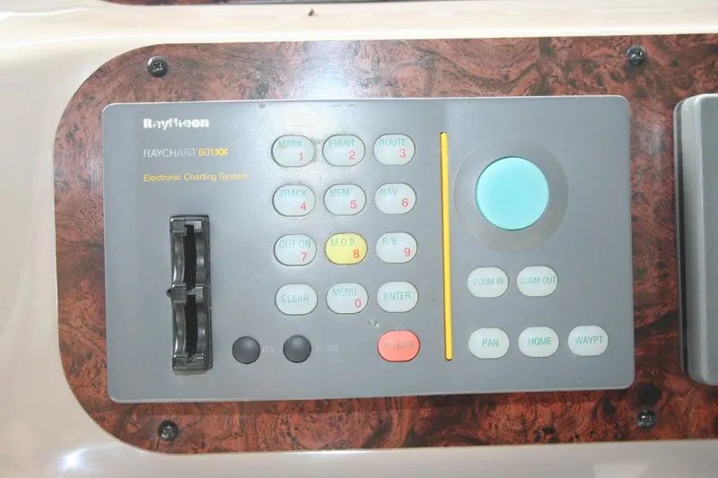 Slide: The Image of 1999 Sea Ray 400 Sundancer interior with speaker system and control panel. - 35