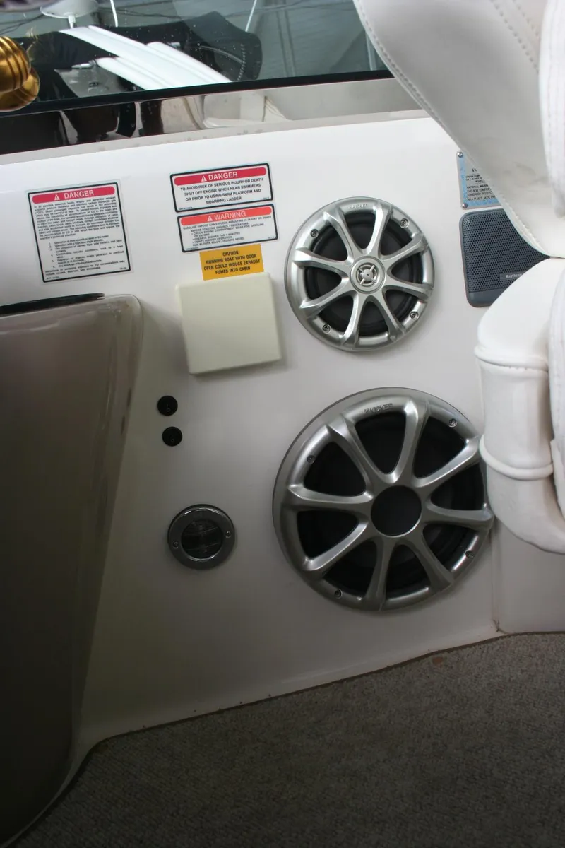 Slide: The Image of Interior view of a 1999 Sea Ray 400 Sundancer boat with blue canopy and speaker. - 39