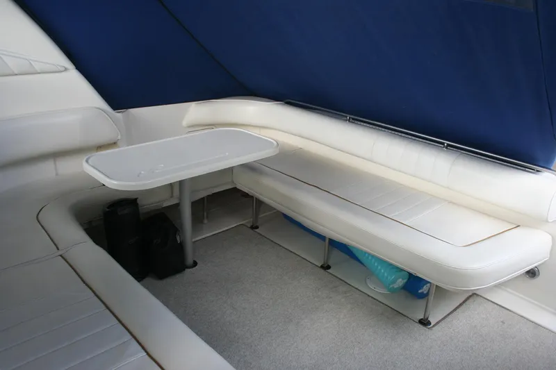 Slide: The Image of 1999 Sea Ray 400 Sundancer yacht docked at marina, side view. - 44