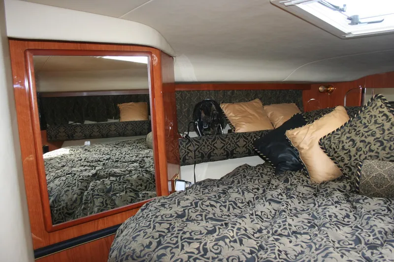 Slide: The Image of Shower area in 1999 Sea Ray 400 Sundancer yacht, featuring modern fixtures and storage space. - 7