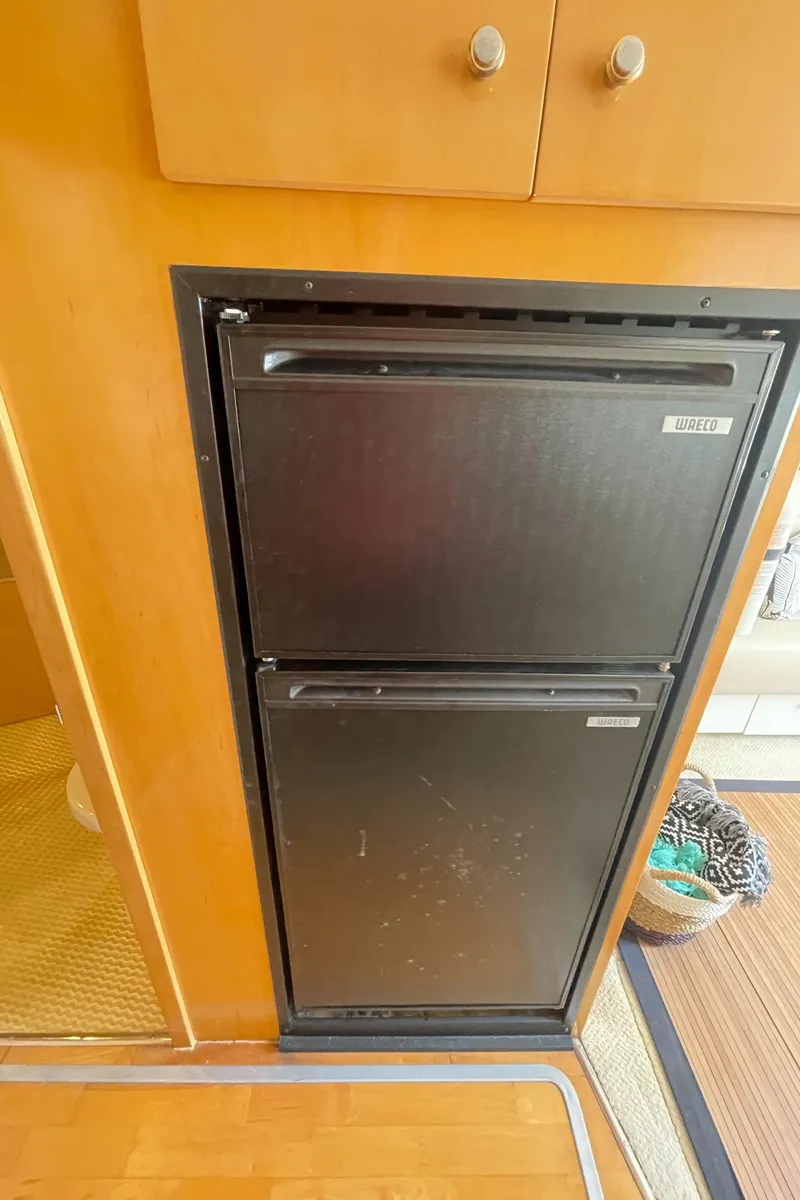 Slide: The Image of Built-in refrigerator in a 2000 Carver 350 Mariner yacht interior. - 15