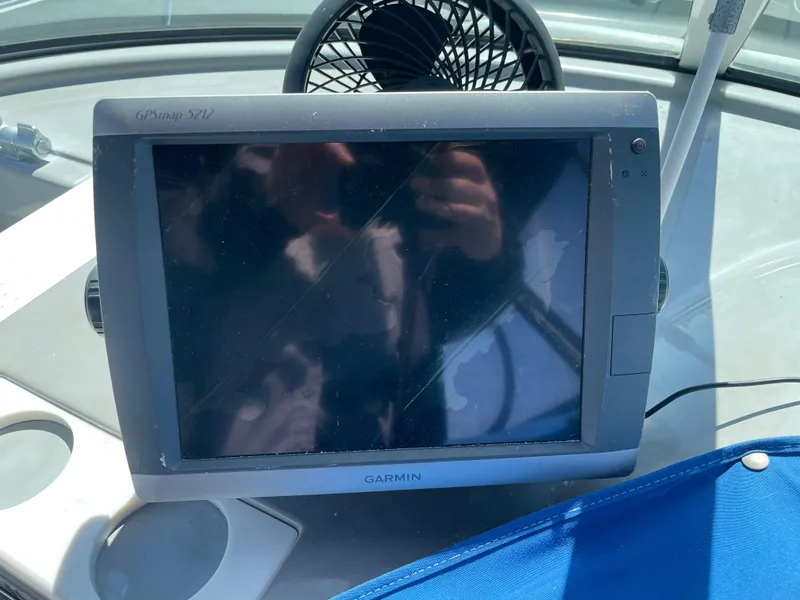 Slide: The Image of Interior of 2000 Carver 350 Mariner yacht with beige seating and wooden table. - 20