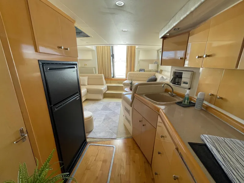 Slide: The Image of Luxurious interior of 2000 Carver 350 Mariner yacht with plush seating and modern decor. - 29