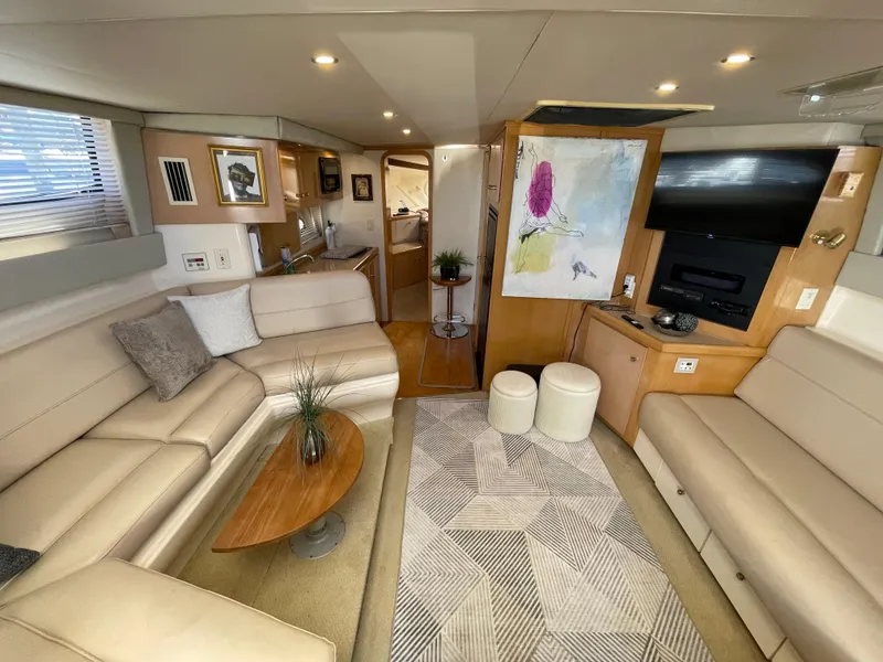 Slide: The Image of Interior of 2000 Carver 350 Mariner yacht with beige seating and modern decor. - 30