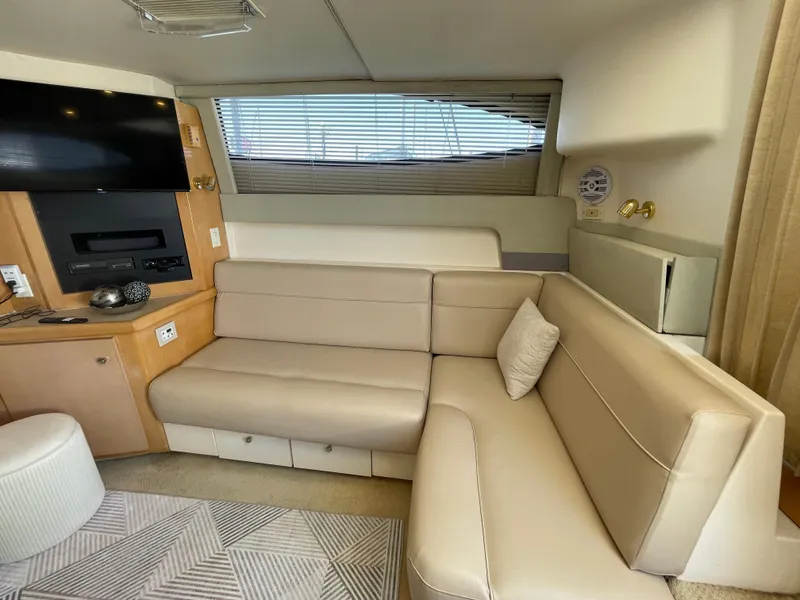 Slide: The Image of Interior of 2000 Carver 350 Mariner yacht with modern kitchen and seating area. - 32