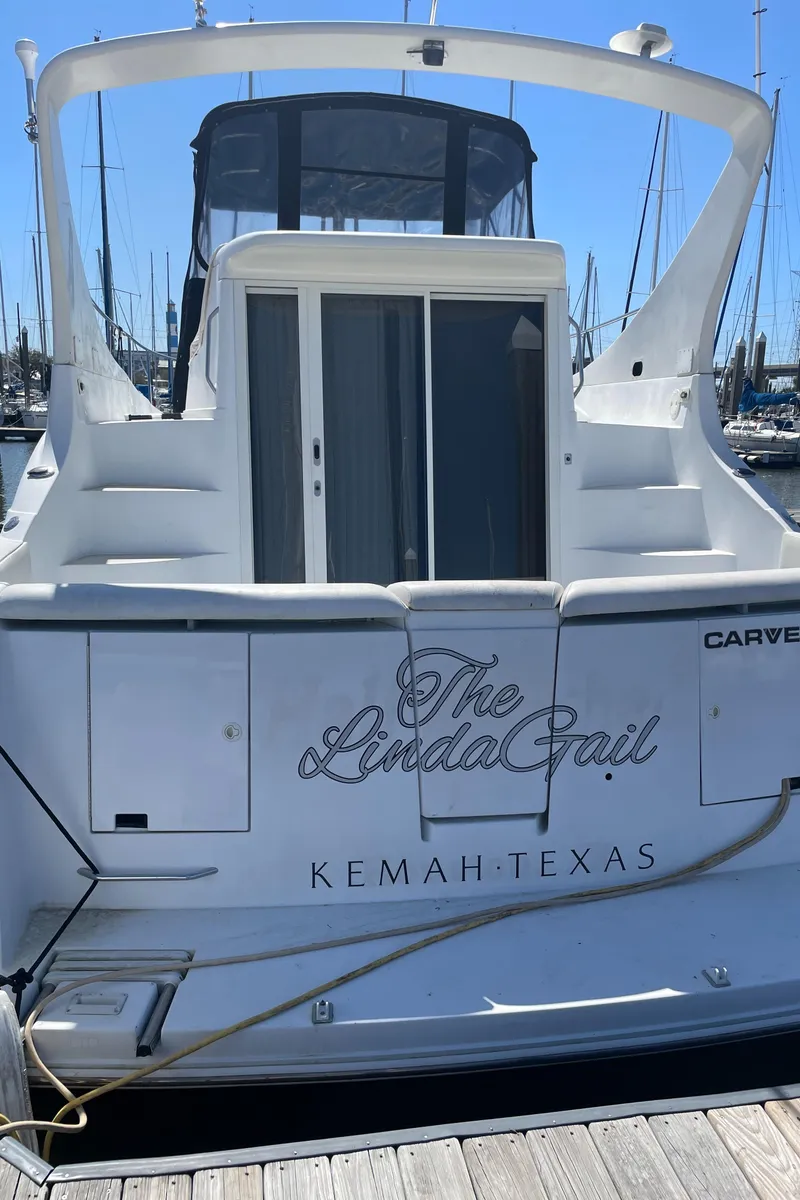 Slide: The Image of Interior of 2000 Carver 350 Mariner yacht bathroom with sink, mirror, and shower. - 40
