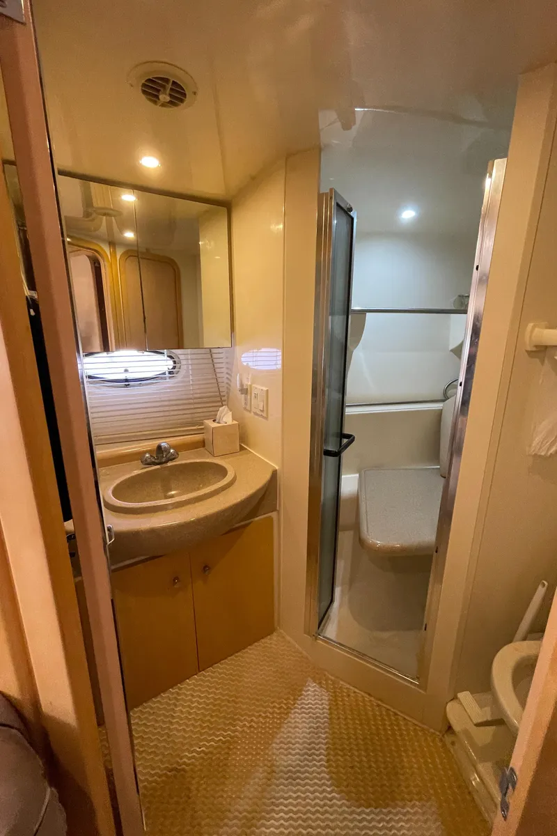 Slide: The Image of 2000 Carver 350 Mariner yacht with illuminated interior and exterior at night. - 43