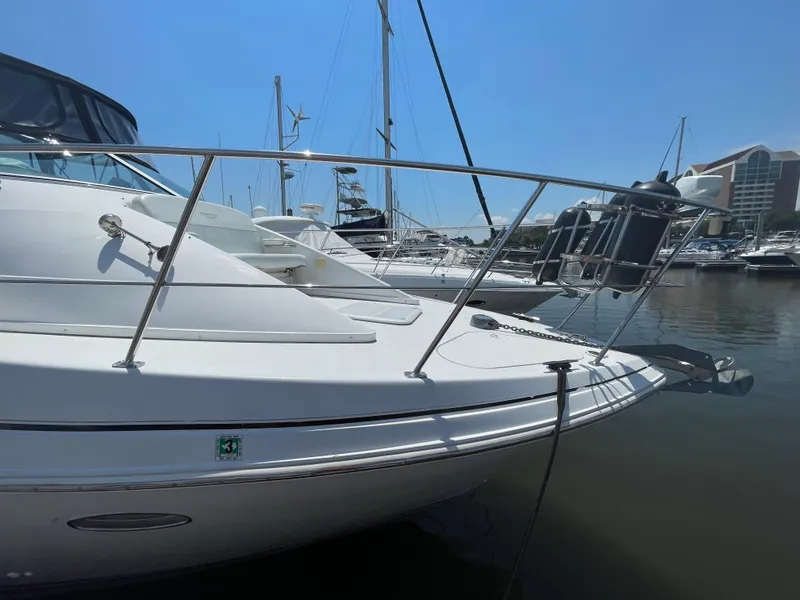 Slide: The Image of 2000 Carver 350 Mariner yacht docked in marina, clear sky, calm water. - 5