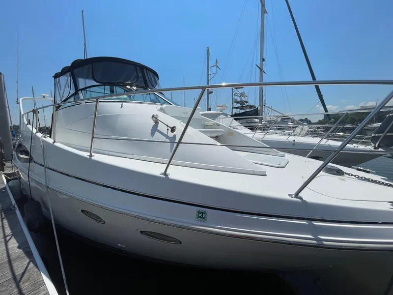 Slide: The Image of 2000 Carver 350 Mariner yacht docked at marina under clear blue sky. - 6