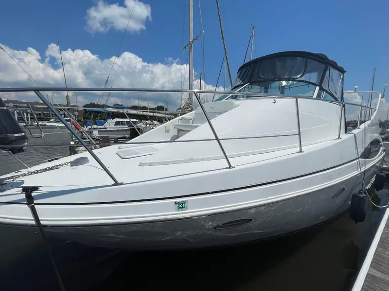 Slide: The Image of 2000 Carver 350 Mariner yacht docked at marina under blue sky. - 7