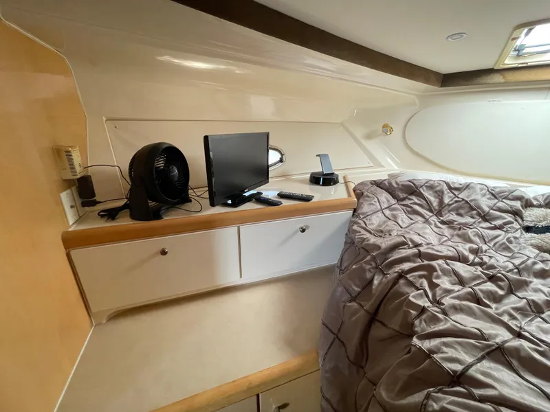 Slide: The Image of Interior of 2000 Carver 350 Mariner yacht with modern furnishings and decor. - 28