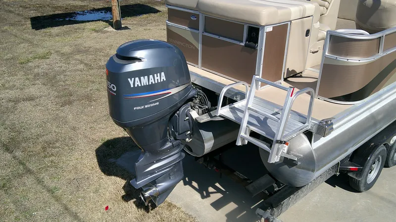 Slide: The Image of 2011 Bennington 2571 GLi pontoon boat with Yamaha outboard motor on trailer. - 10