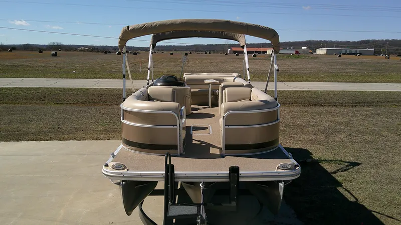 Slide: The Image of 2011 Bennington 2571 GLi pontoon boat on trailer, parked outdoors. - 3