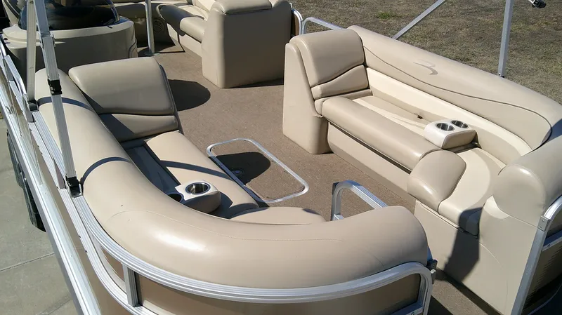 Slide: The Image of 2011 Bennington 2571 GLi pontoon boat with beige seating and cup holders. - 4