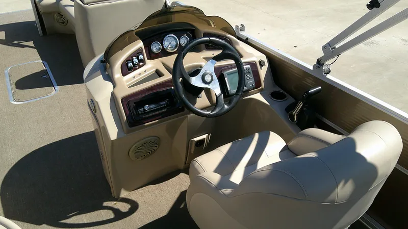 Slide: The Image of 2011 Bennington 2571 GLi boat dashboard with steering wheel and controls. - 6