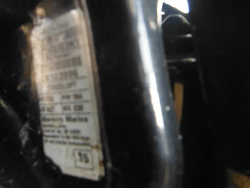 Slide: The Image of Blurry close-up of a label on a 1999 Robalo 2440 Walkaround boat. - 10