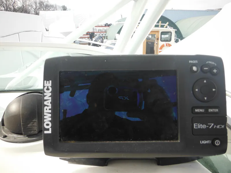 Slide: The Image of Lowrance Elite-7 HDI fishfinder on 1999 Robalo 2440 Walkaround boat dashboard. - 22