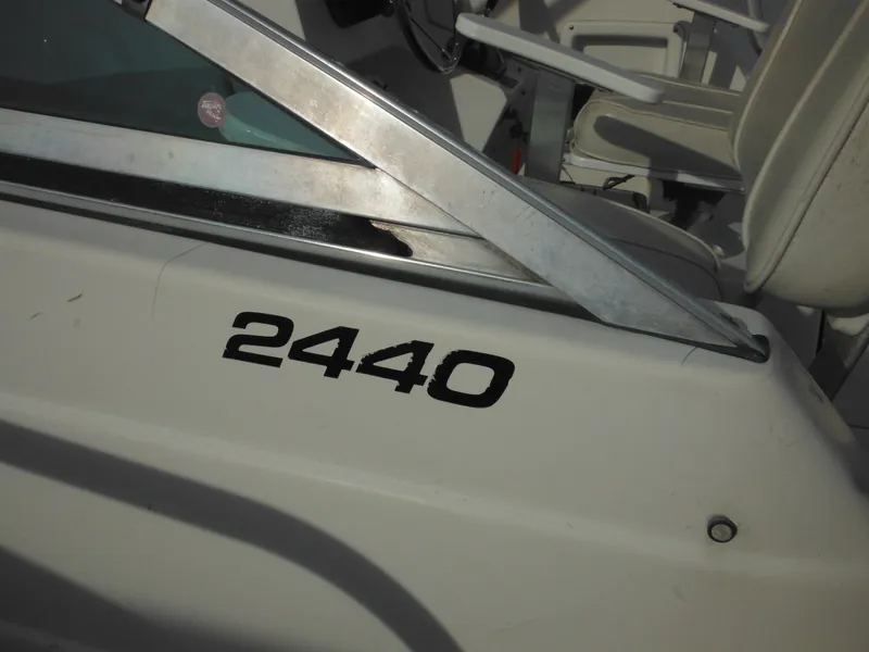 Slide: The Image of 1999 Robalo 2440 Walkaround boat, close-up of model number on side. - 25