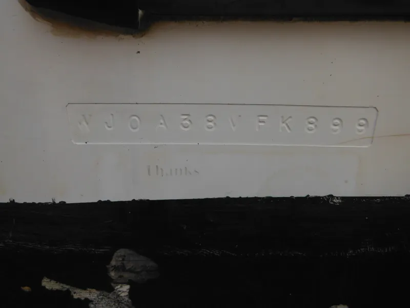 Slide: The Image of 1999 Robalo 2440 Walkaround boat hull identification number (HIN) close-up. - 9