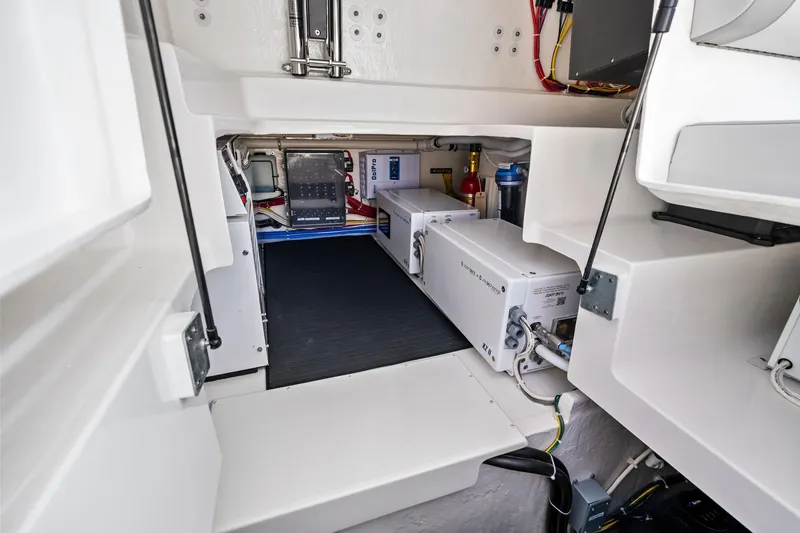 Slide: The Image of Engine room of 2026 Albemarle 45 Carolinian boat, showcasing equipment and wiring. - 23