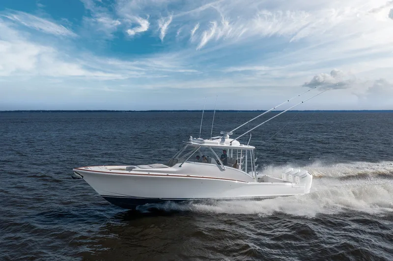 Slide: The Image of 2026 Albemarle 45 Carolinian cruising on open water under a partly cloudy sky. - 27