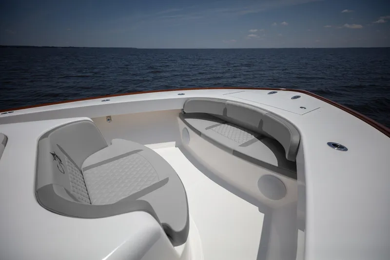 Slide: The Image of 2026 Albemarle 45 Carolinian boat deck with seating, overlooking calm ocean waters. - 31