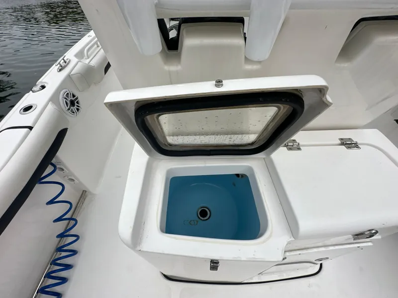 Slide: The Image of Open storage compartment on 2022 Tidewater 280 CC Adventure boat. - 12